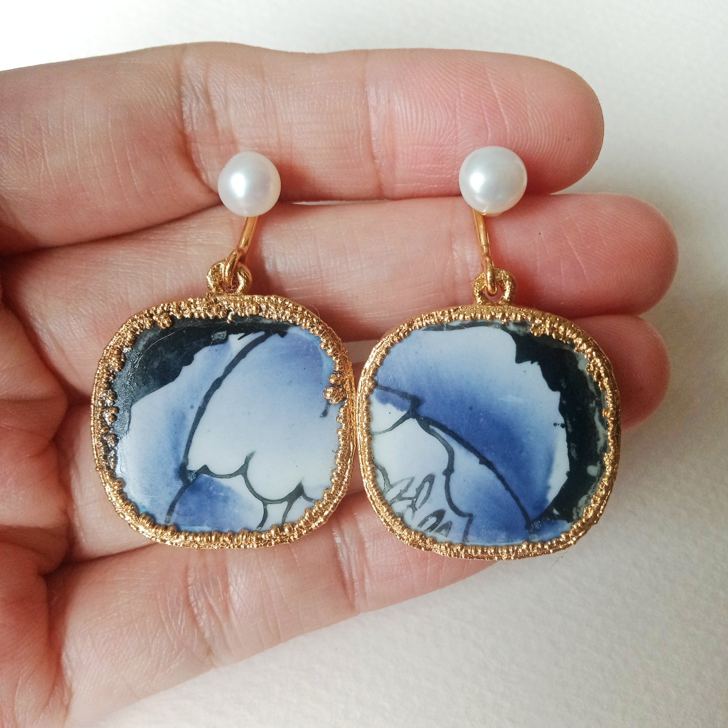 Indigo blue abstract foliage porcelain FW pearl earrings