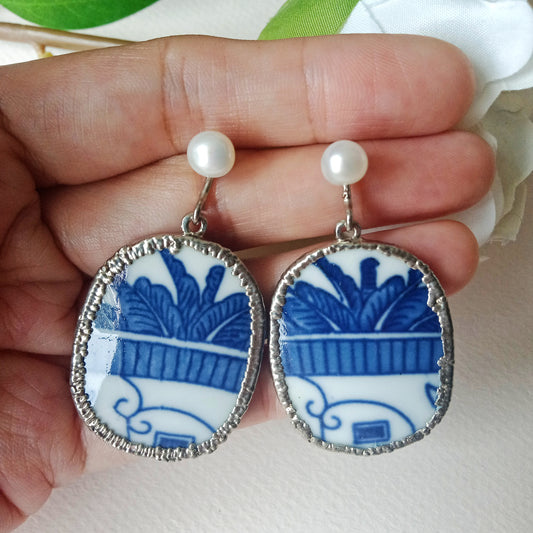 Blue and white palm trees in courtyard porcelain silver tone earrings